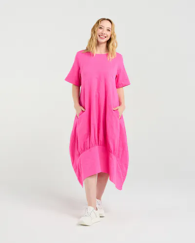 Model wearing Hot Pink Selena Dress By Seduce Available at Beetees Nelson